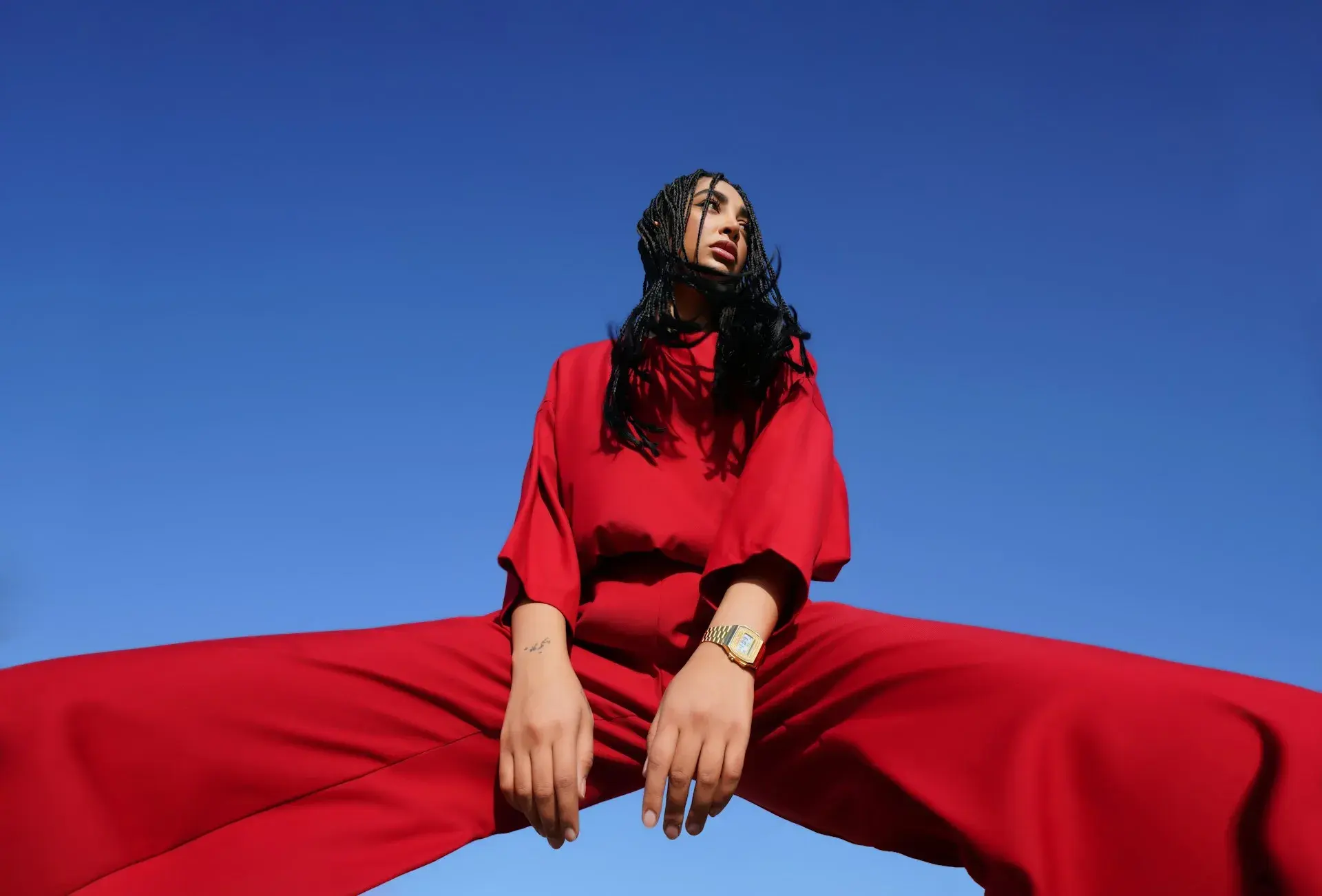 Creator in a red editorial look